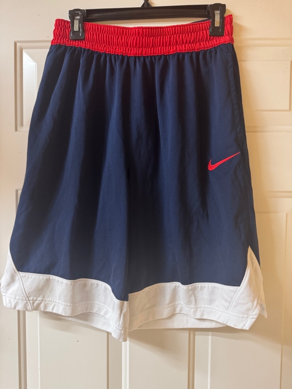 Nike Men's Navy Blue Athletic Shorts with Red Waistband and White Hem